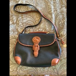 Dooney & Bourke Black and Tan leather purse. Medium size. No signs of wear.
